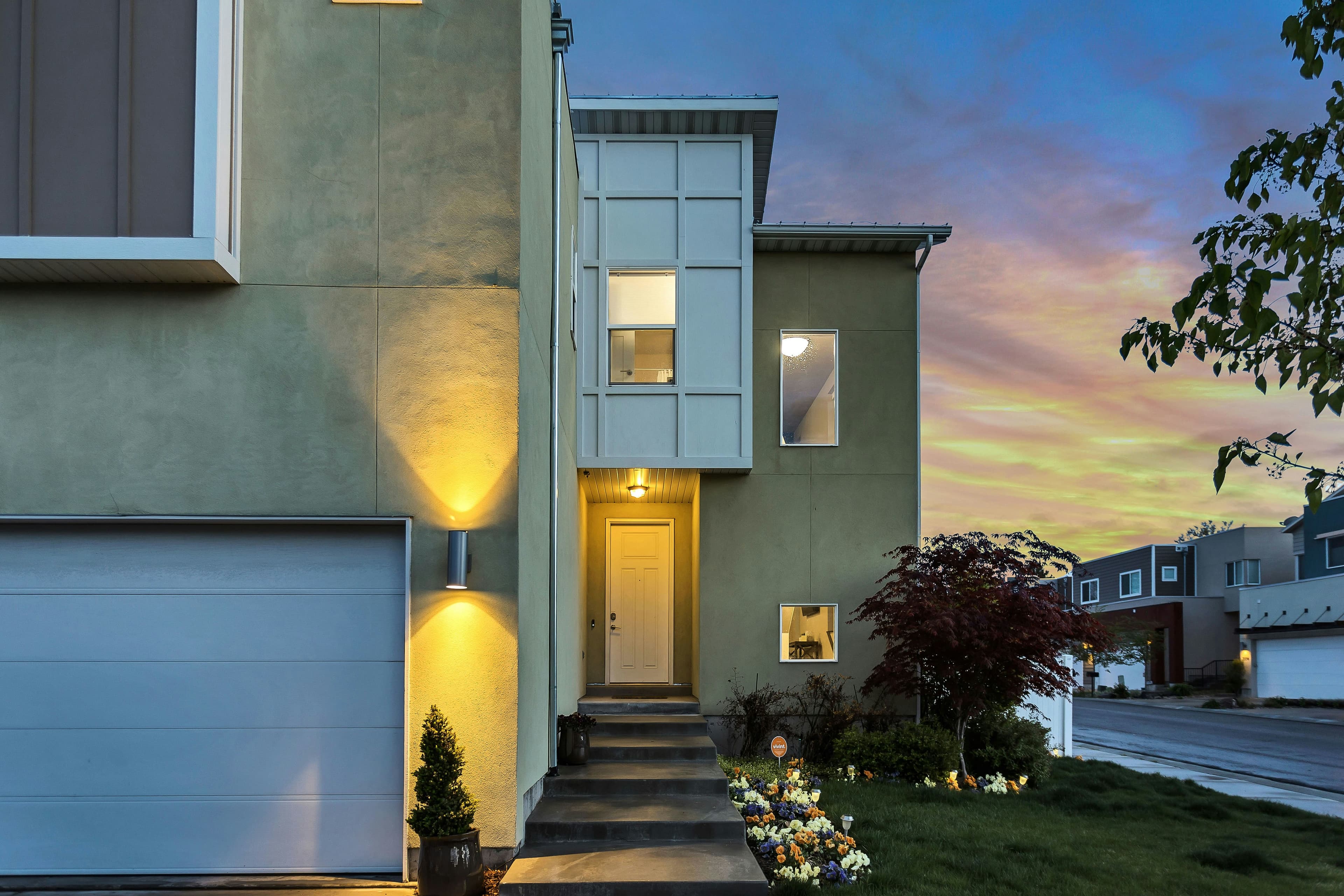 Lit entrance of a modern house