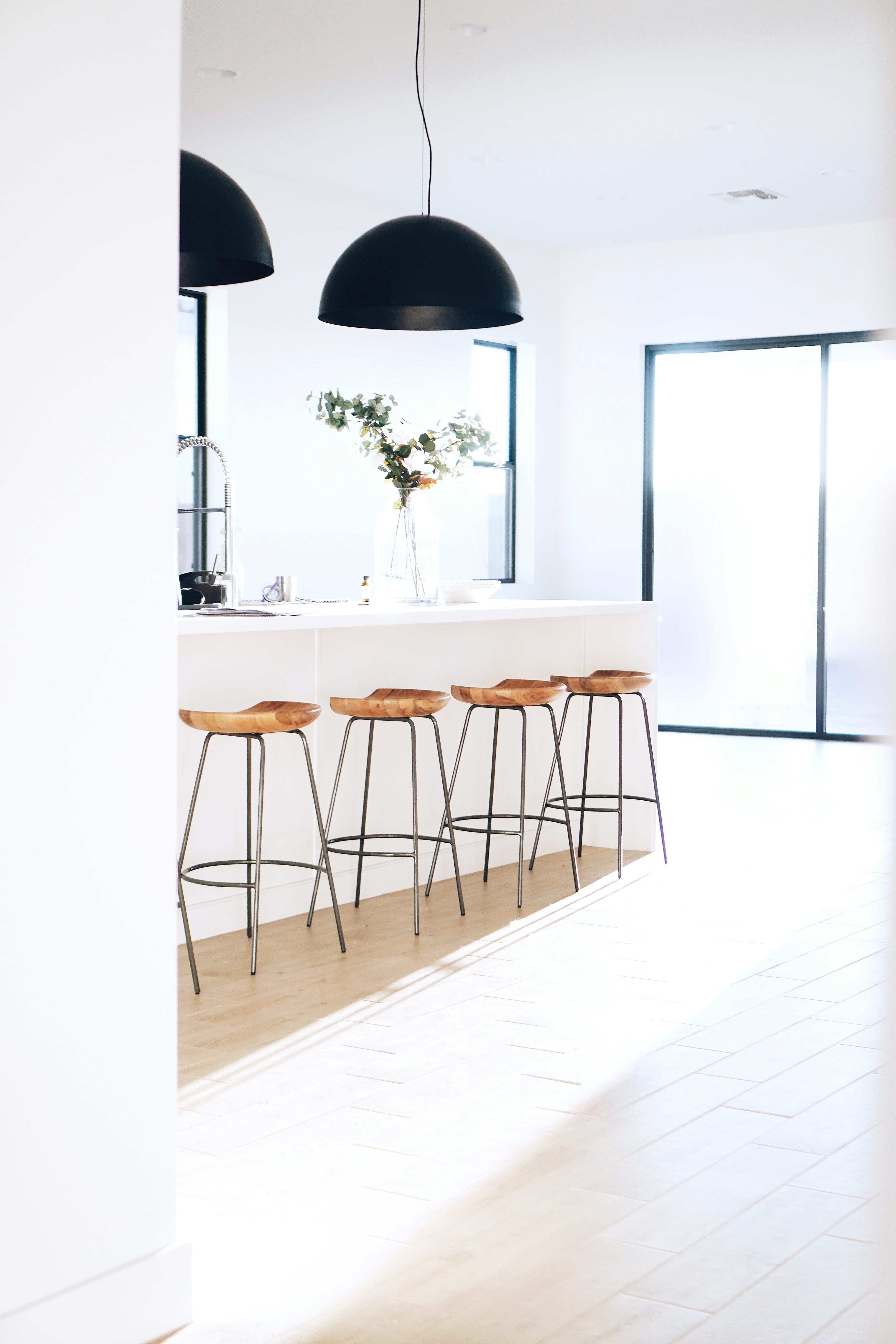 White kitchen with timber bar stools