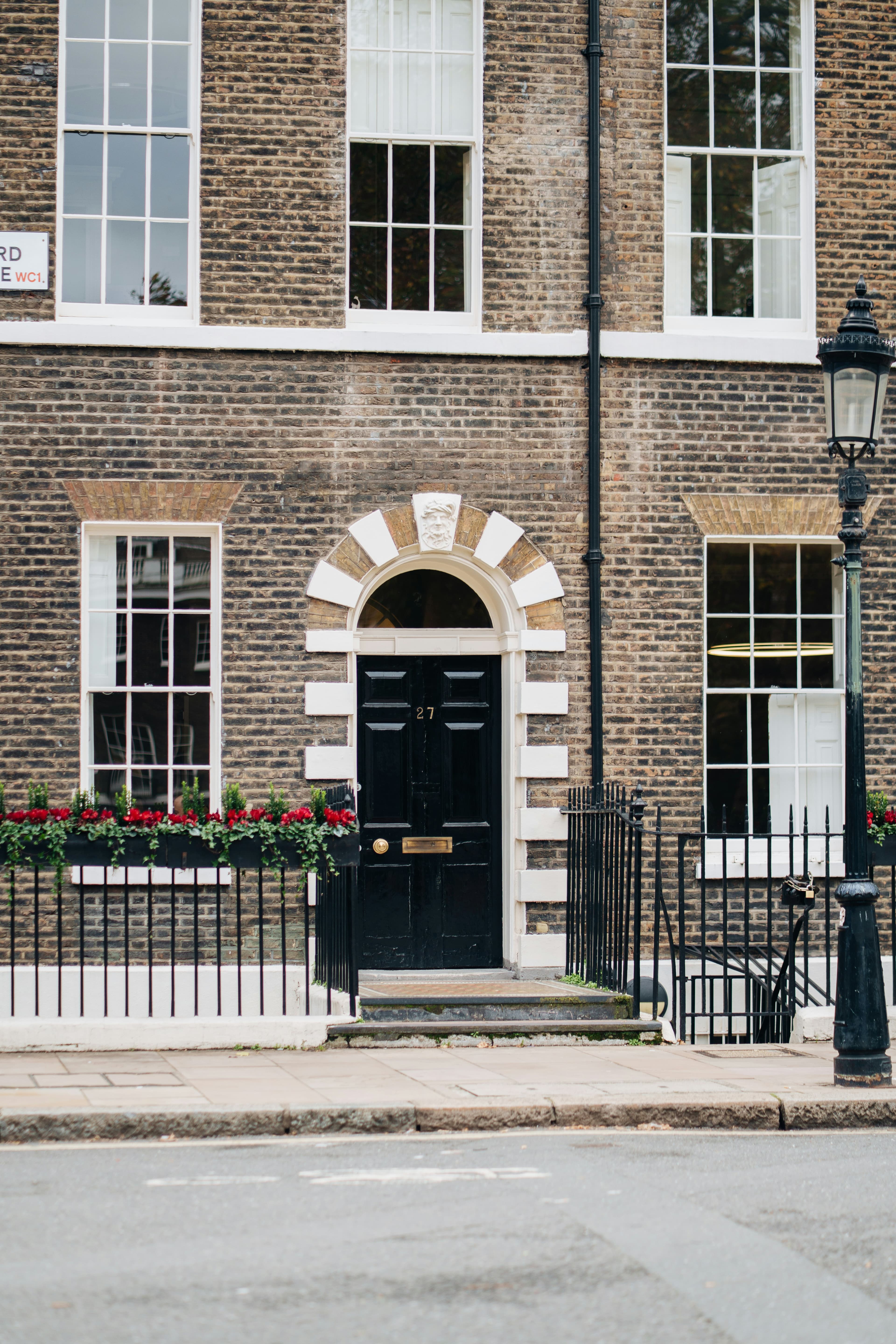 Georgian brick townhouse with a black front door