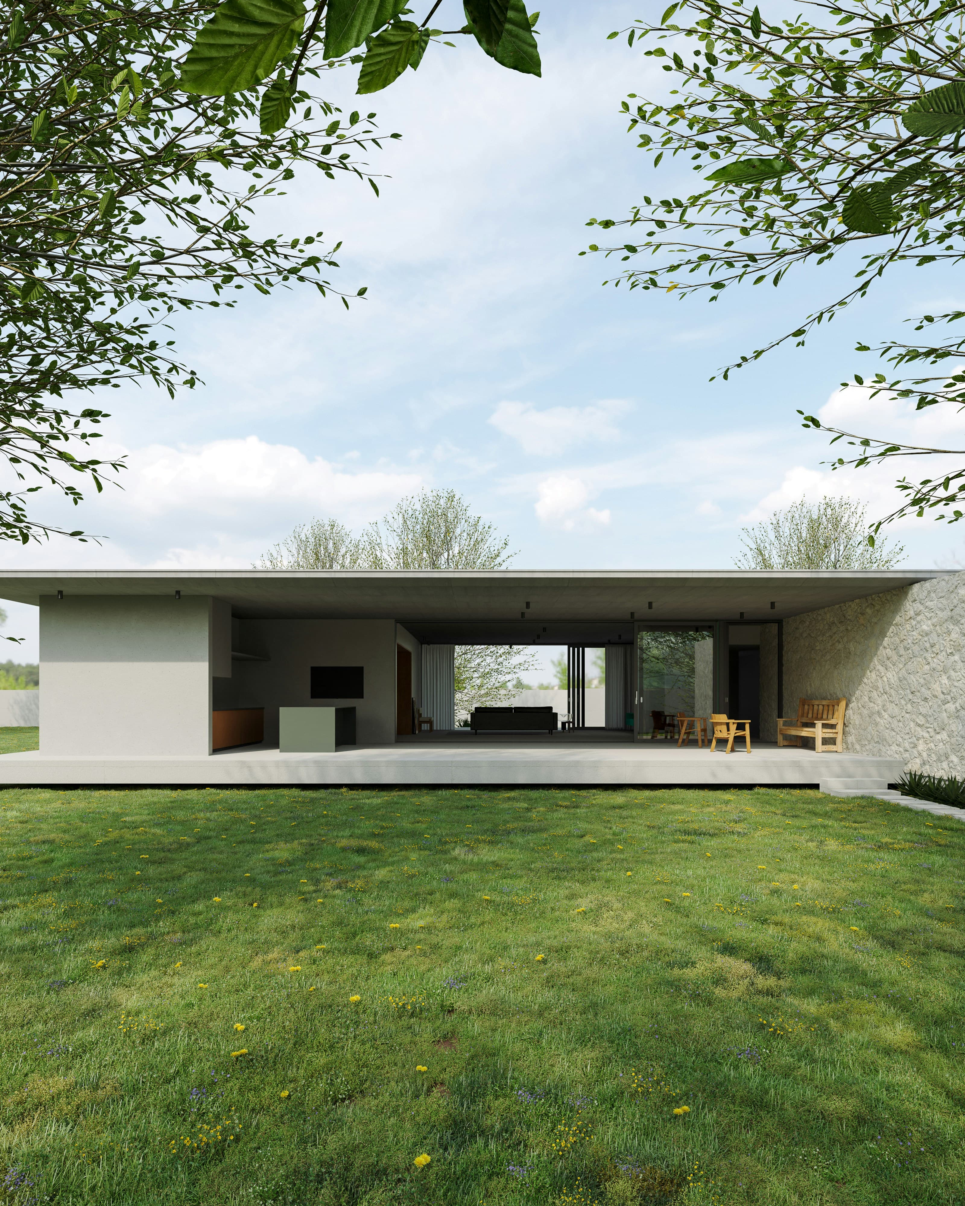Single storey house with a stone wall opening onto a lawn